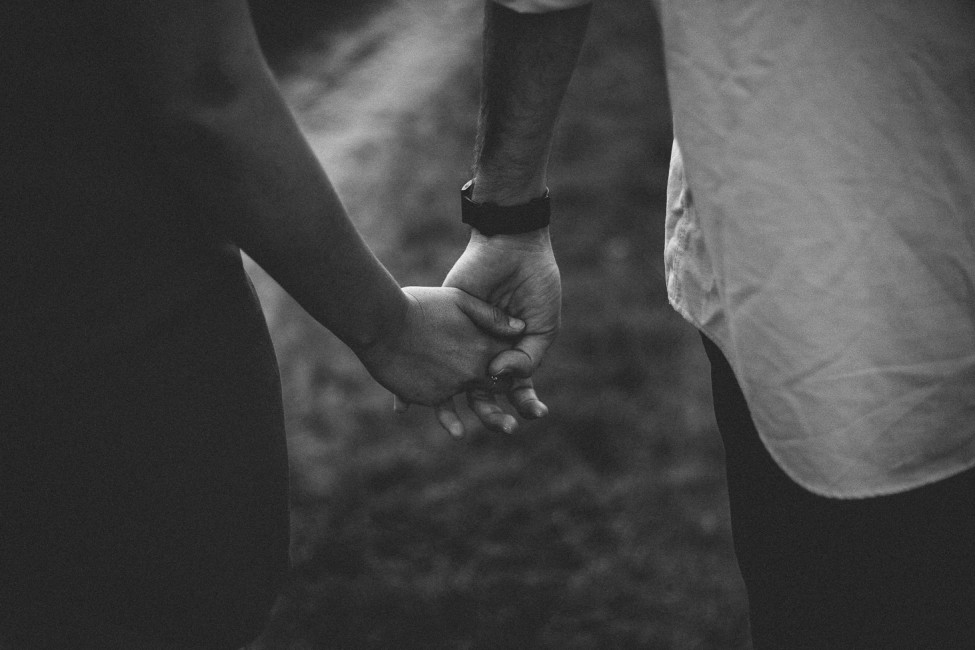 Holding hands during a prewedding rehearsal session.