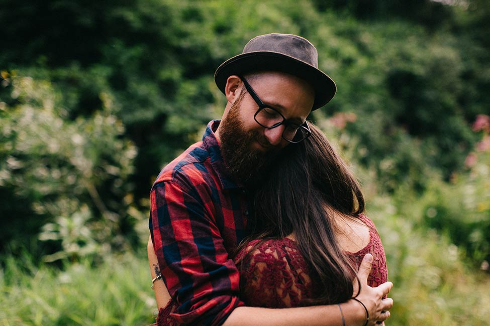 A lover's embrace is captured on this adventure engagement session in Europe.