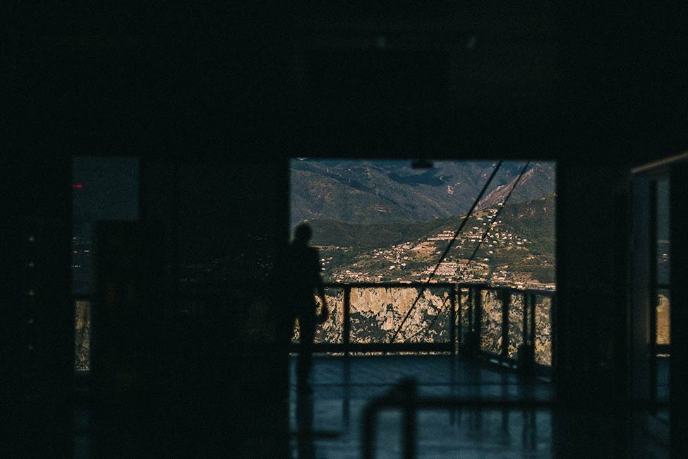 Riding the funicular up Monte Baldo, for an adventure wedding in Lake Garda.