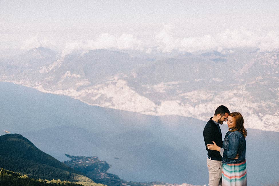 Adventurous couple takes destination wedding photos in Lake Garda, Italy.