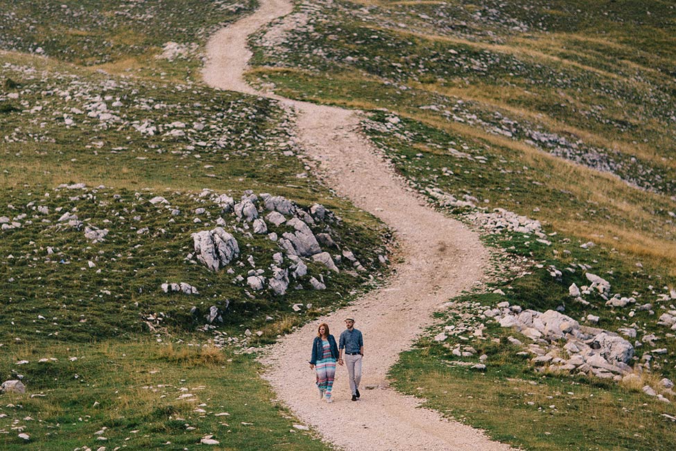 Walking along monte baldo for an italian elopement.