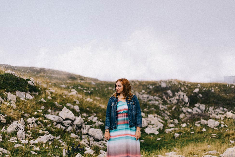 Eleonora, of Enrico and Eleonora Fotografo Matrimonio in Verona, Italy wedding photographer, poses on Mount Baldo.