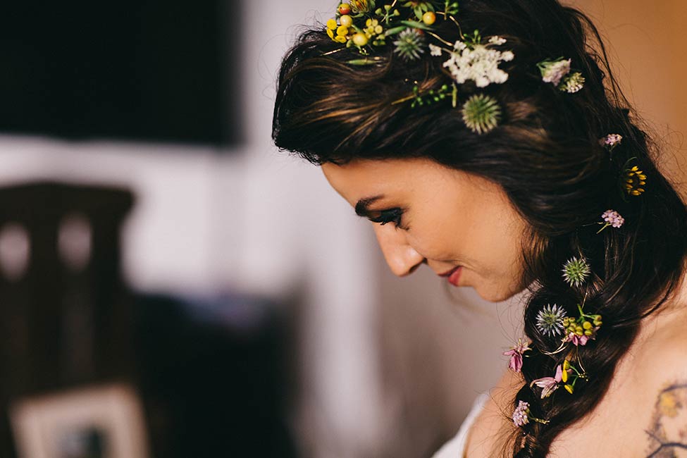 The small details of flowers in a bride's hair complete a wedding day.