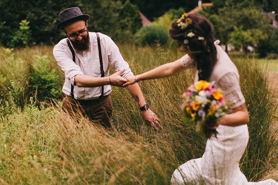 Make sure you have boots when you wander through high grass in wedding portraits near Vienna.
