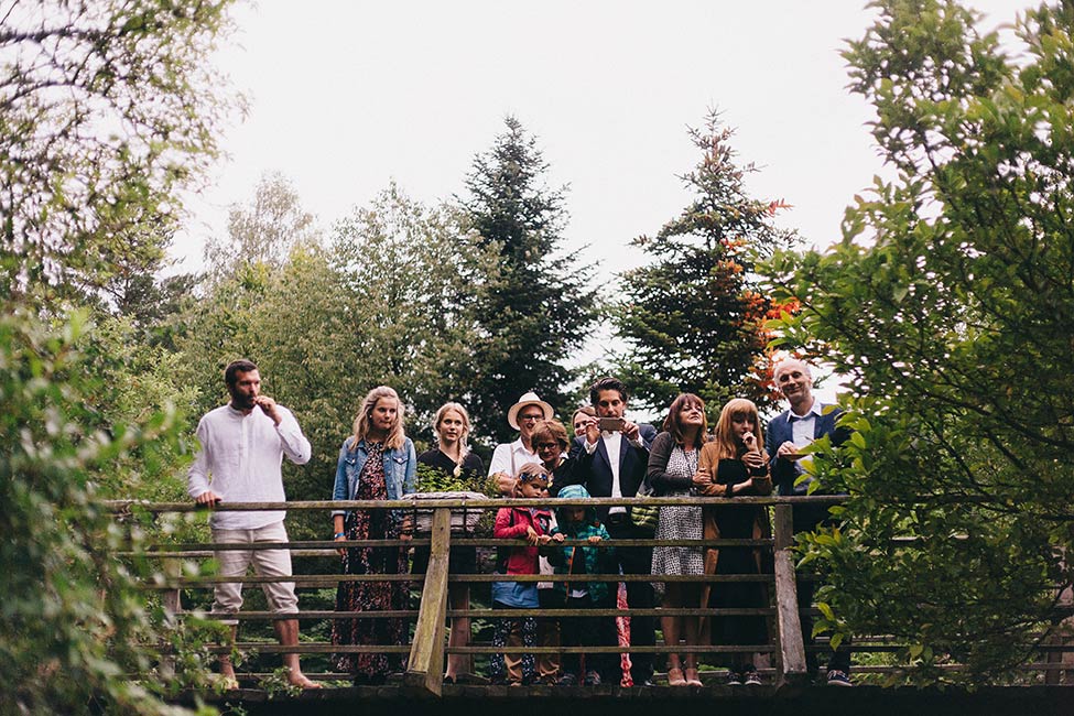 Wedding guests gather to watch wishes sail down the creek in Pressbaum Austria.