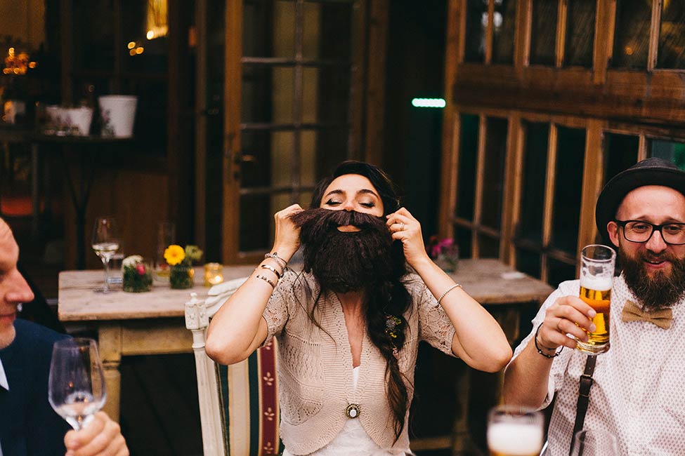 The bride does her best to look like her bearded beau